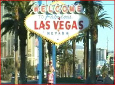 CRAZY SEMI NAKED GUY IN A BARREL THROWS PAINT AT FAMOUS LAS VEGAS SIGN