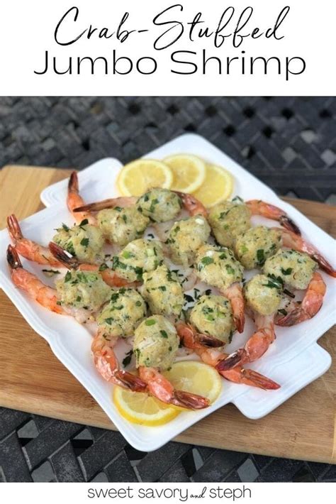 Crab Stuffed Jumbo Shrimp On A Plate With Lemon Wedges