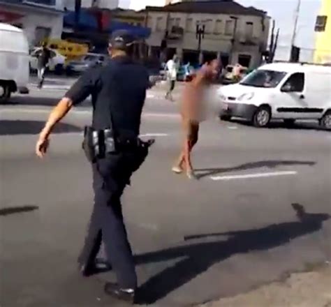 Naked Man Causes Carnage As He Waves A Butchers Knife At Onlookers In The Street Before Being