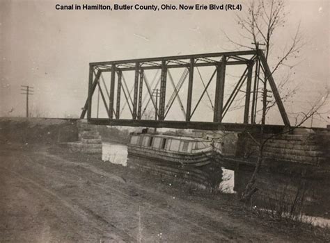 Canal in Hamilton, Ohio. One of the earliest train bridges there. c ...