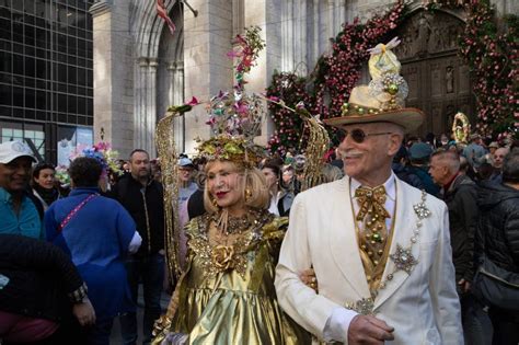 A Couple In Elaborate Gold Costumes At Easter Bonnet Parade Editorial