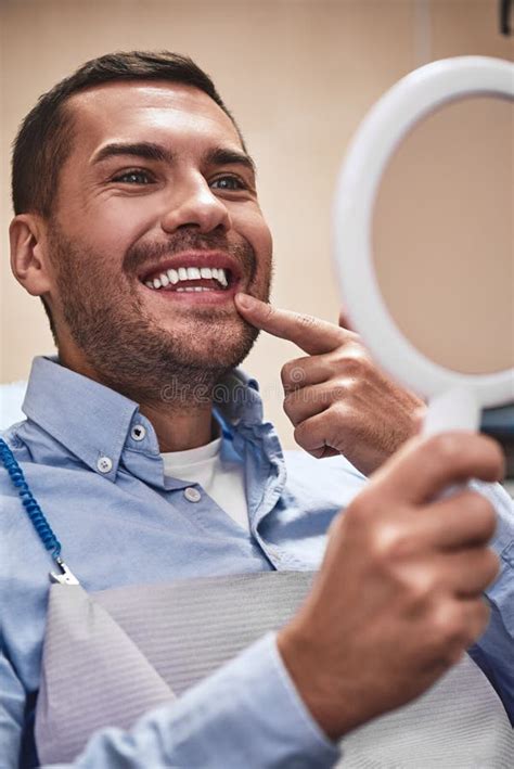 For A Lifetime Of Smiles Handsome Male Patient Looking At His