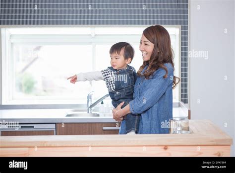 Mother Holding Child Stock Photo Alamy