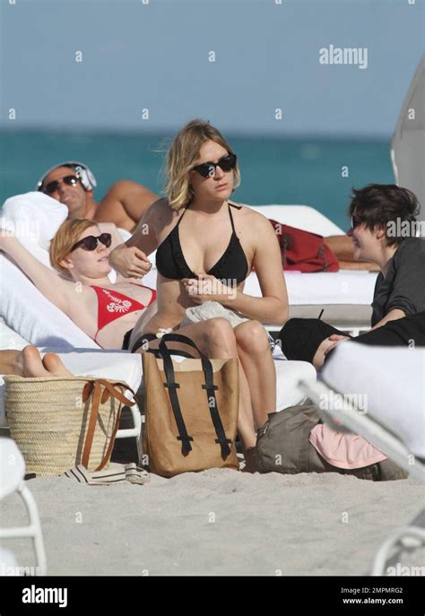 Chloe Sevigny Relaxes On Miami Beach In A Black Bikini With Friends
