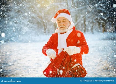 Cold December. Santa Claus Going with a Bag of Gifts in the Winter on ...
