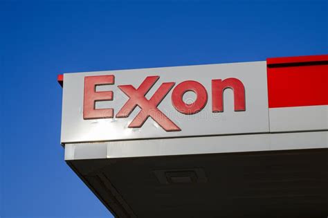 Exxon Fuel Company Sign Against Blue Sky With Hot Spot Highlight On