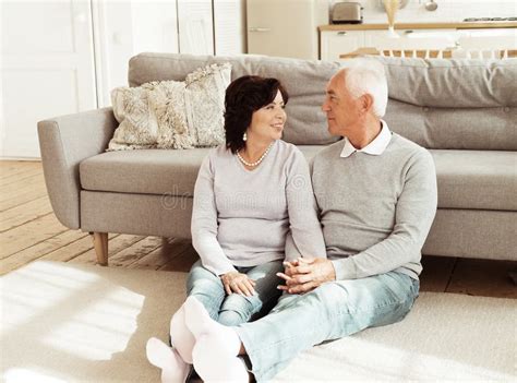 Mature Year Old Couple Hugging While Sitting On The Bed In The Bedroom Love Forever Stock
