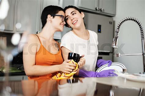 Homosexual People Lesbian Women Doing Chores And Dish Washing Together Stock Image Colourbox