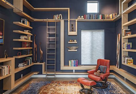 Modern custom home library with rolling ladder | bookcases