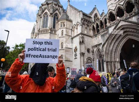 A Protester Holds A Placard Expressing His Opinion During The