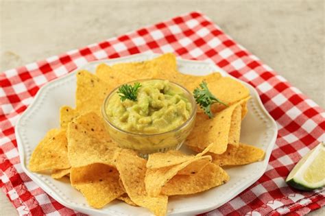 Premium Photo Nachos With Guacamole Avocado Sauce