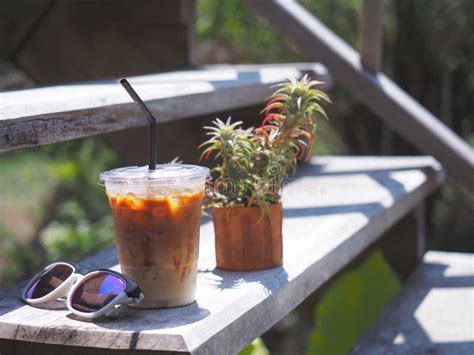 Glass Of Iced Coffee And Sunglasses On Table Stock Photo Image Of