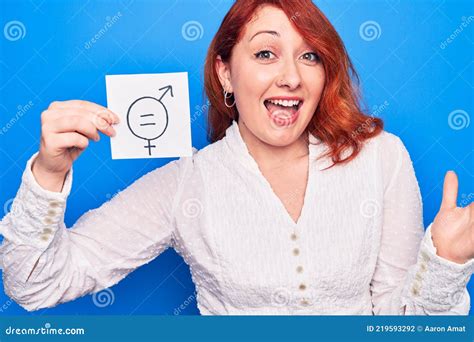 Young Redhead Woman Asking For Sex Discrimination Holding Paper With