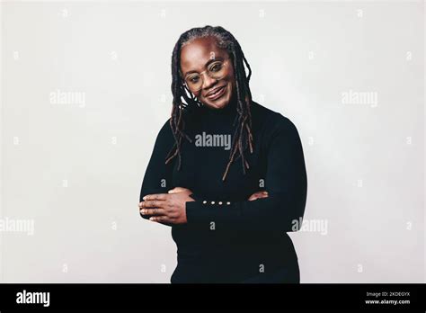 Professional Woman With Dreadlocks Smiling At The Camera While Wearing Eyeglasses Happy Mature