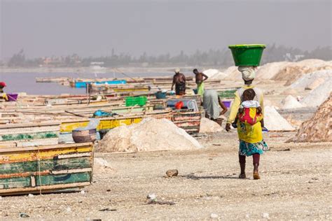 LAC ROSE, SENEGAL - NOVEMBER 13, 2019: Boats at Lac Rose or Retba Lake ...