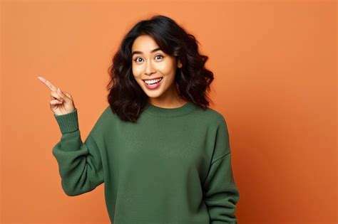 Premium AI Image Smiling Asian Brunette Woman In Sunglasses Pointing Fingers Sideways Left And