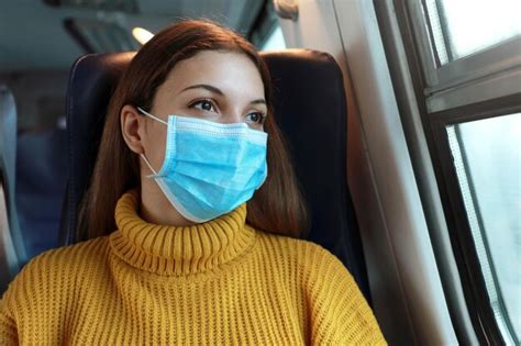 Premium Photo Young Woman In Mask Sitting At Bus