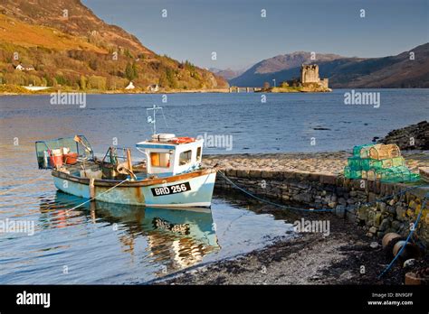 Local Fishing Boat And Eilean Donan Castle Loch Duich Scottish