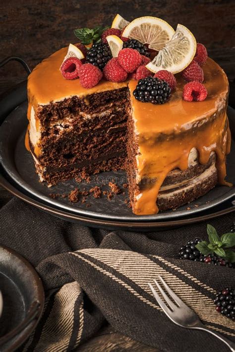 Delicious Semi Naked Chocolate Cake With Caramel Topping And Decorated With Blackberries And