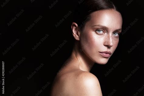 Beauty Woman Portrait With Nude Makeup Shooted On A Black Background Adobe Stock