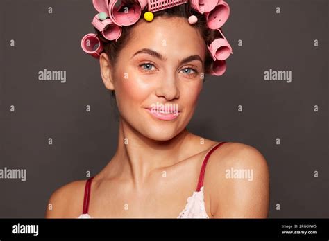 Portrait Of Young Woman Wearing Hair Rollers Stock Photo Alamy