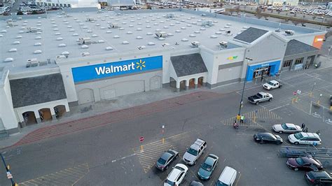 Aerial View Of Walmart Entrance From A Low Angle Photo Background And