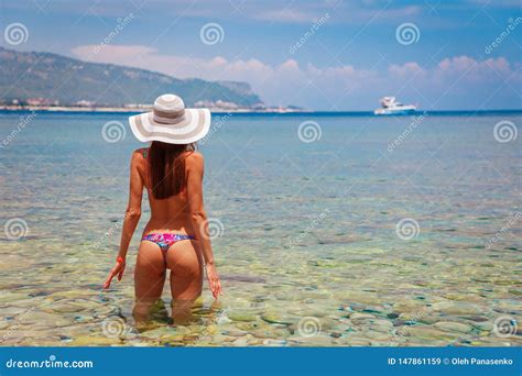 Back Of Beautiful Woman In Bikini And Creative Hat On Sea Background Sea Coast Near Kemer