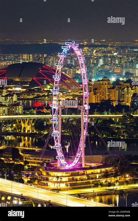 The Singapore Flyer and the Singapore National Stadium Stock Photo - Alamy