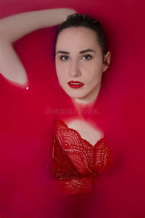Portrait Of A Beautiful Brunette In Red Lingerie In Red Water Horror Films Photoshoot In The