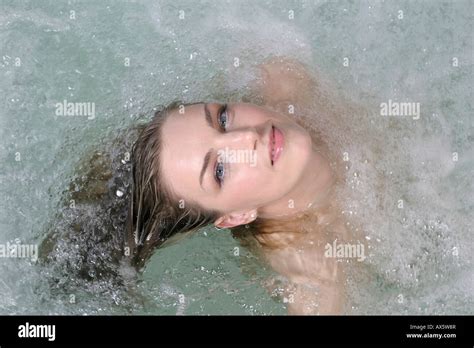 Portrait Of A Partially Nude Woman Laying In A Jacuzzi Hot Tub Looking Upwards Stock Photo Alamy