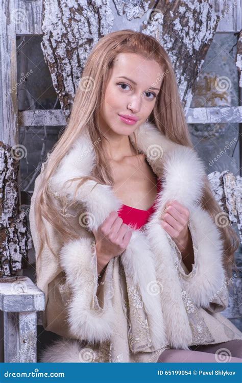 Blonde Girl In Wooden Chair Stock Photo Image Of Wooden Coat