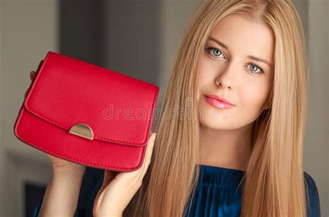 Fashion And Accessories Happy Beautiful Woman Holding Small Red Handbag With Golden Details As