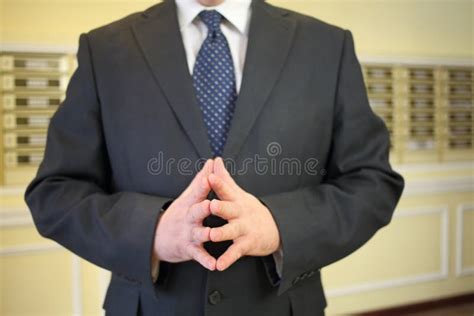 A Man In A Business Suit Joined Fingers With Each Stock Image Image