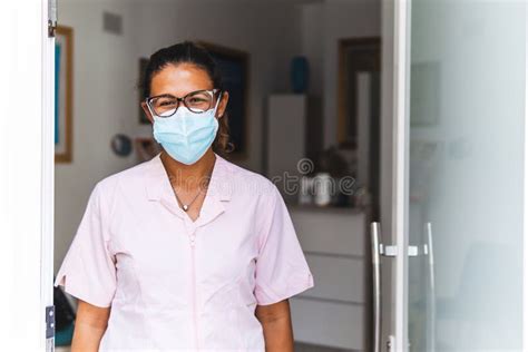 Portrait Of A Dentist On The Entrance Door Of The Office With
