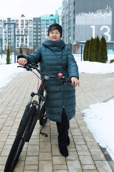 Mature European Woman Extends Longevity And Rides A Bicycle Stock Photo Image Of Adult Female