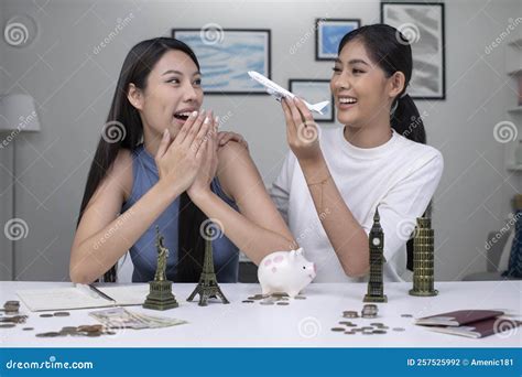 Lesbian Couple Plans To Save Money For A Trip Around The World Travel Budget Concept Stock
