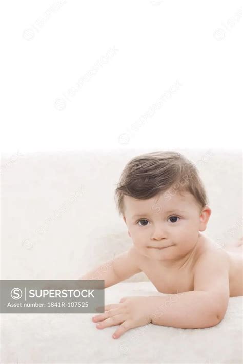 Nude Baby Lying On Sofa Superstock
