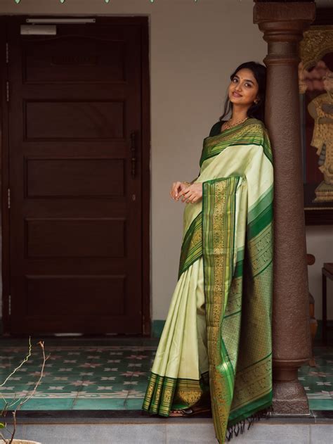 light green kanjeevaram silk saree  dark green border tulsi weaves