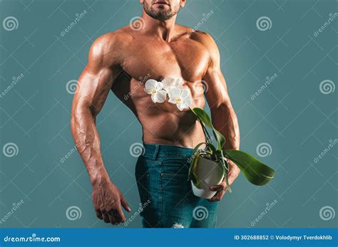 Shirtless Athletic Naked Guy Holds Orchid Impotence Potence Concept Man Power Stock Photo