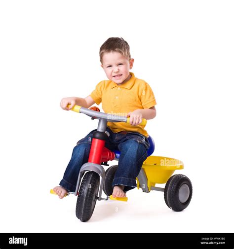 Cute Little Boy Riding A 3 Wheel Bike Isolated On White Background