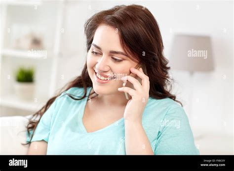 Plus Size Woman Calling On Smartphone At Home Stock Photo Alamy