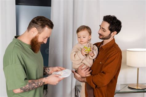Gay Man Holding Diaper Near Partner Stock Photo Image Of Positive Apple 271208830