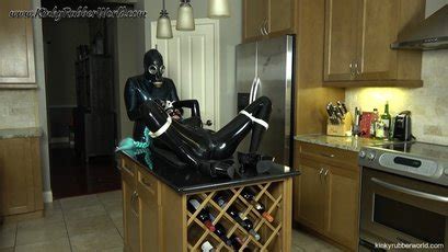 Horny Chick Latex Lara Getting Pleased With A Toy In The Kitchen Photos