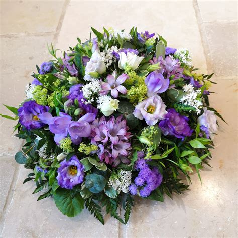 Funeral tribute posy pad lilac and purple flowers | Funeral flower