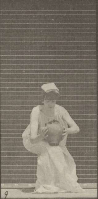 Semi Nude Woman Carrying A Water Jar On Head Turning And Placing It On The Ground Rbm QP301M8