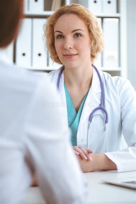 Happy Blonde Female Doctor And Patient Discussing Medical Examination Results Medicine