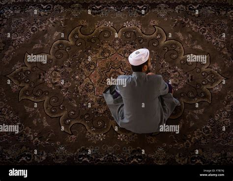 Iranian Shiite Muslim Kneeling And Praying In Mosque Golestan Province