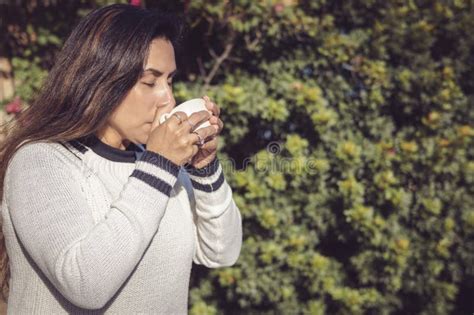 Break To Enjoy Latina Woman Enjoying The Garden With Coffee Stock Photo Image Of Relaxation
