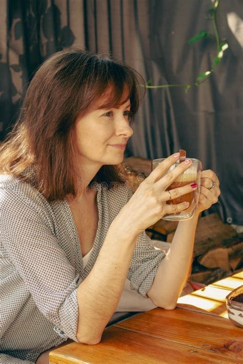 Pretty Woman Drinking Coffee In Sidewalk Cafe Brunette With Morning Coffee Authentic Lifestyle