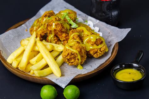 Close-up Photo of French Fries and Fried Chicken Wings · Free Stock Photo